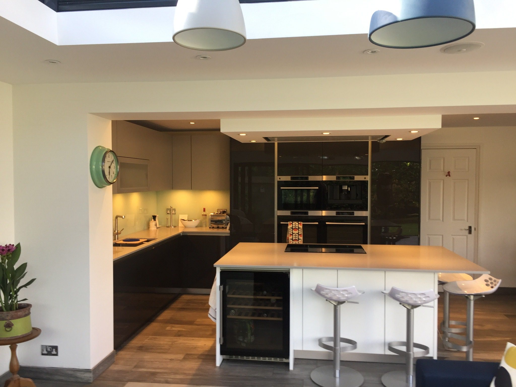 Traditional kitchen orangery extension in Kingston, Surrey — interior showing roof lantern and open-plan layout
